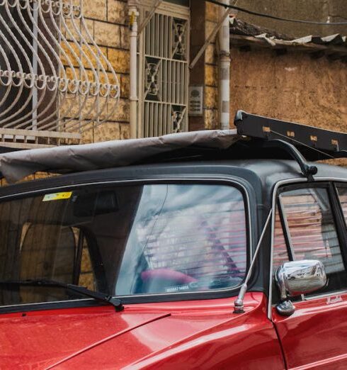 Jackets - A red car parked on the side of a street