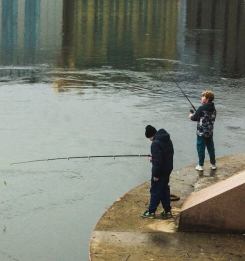 Jackets - People fishing on the edge of a river