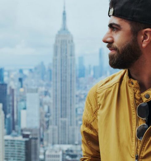 Jacket - Portrait Photo of Man in Yellow Zip-up Jacket Near Empire State Building