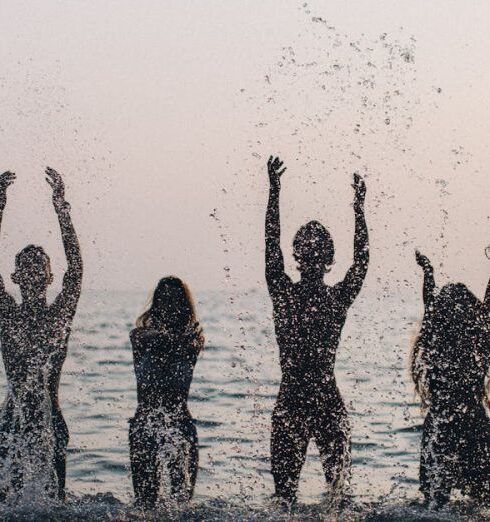 Swimsuits - 3 Women in Water With Water Droplets