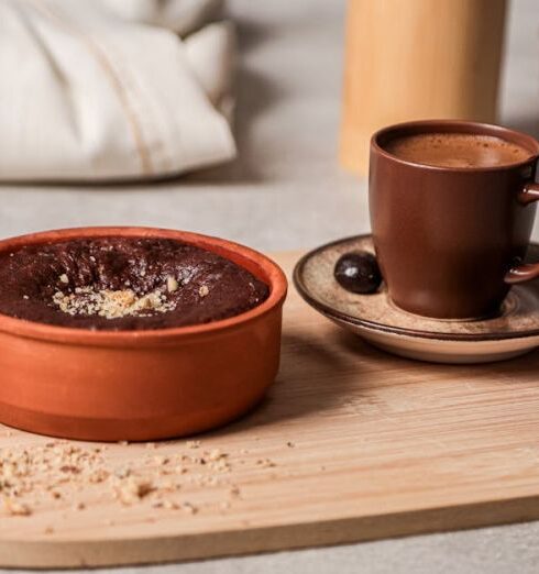 Cover-Ups - A wooden tray with two cups of coffee and a bowl of chocolate