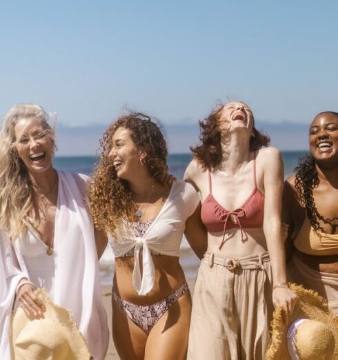 Bikinis - A Group of Women Walking on the Beach