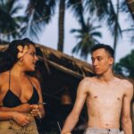 Swimsuits - Topless Man in Brown and Black Leopard Print Bikini Bottom Sitting on Brown Wooden Bench during