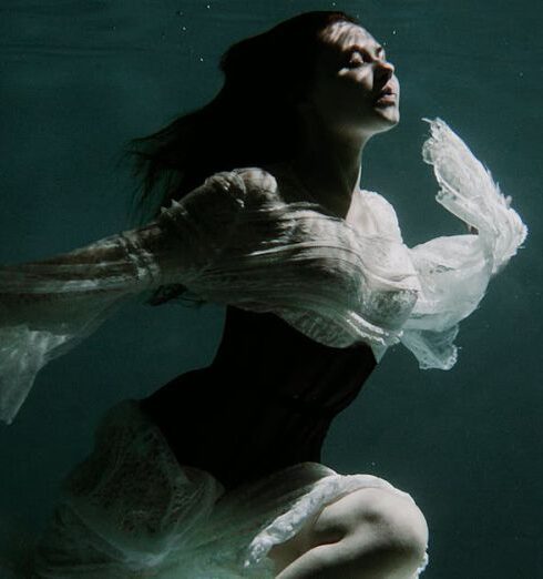 Swim Skirts - Woman in White Skirt Swimming Underwater