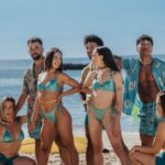 Bikinis - Group of Friends Posing Together on a Sandy Beach