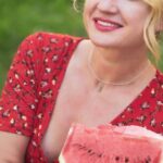 Healthy Eating - A woman in a red dress holding a watermelon