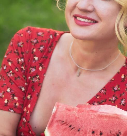 Healthy Eating - A woman in a red dress holding a watermelon