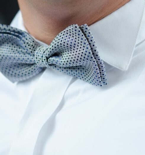 Bow Tie - Man in White Dress Shirt Blue Suspenders and Gray Polka Dotted Bowtie