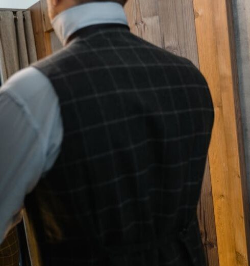 Formalwear - Man in Black and White Checked Suit Standing Beside Man in Blue Suit