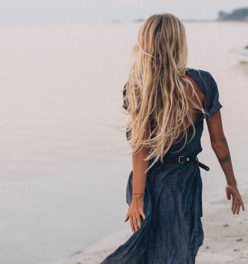 Dress - Back View of a Woman Walking on the Seashore