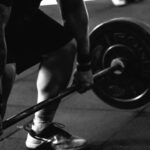 Weightlifting - Man Carrying Barbel