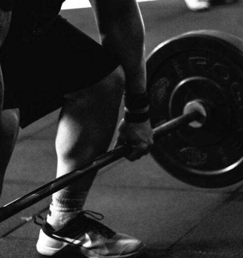 Weightlifting - Man Carrying Barbel