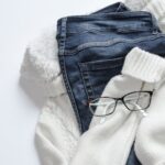 Jeans - Black Framed Eyeglasses On White Jacket And Blue Denim Bottoms