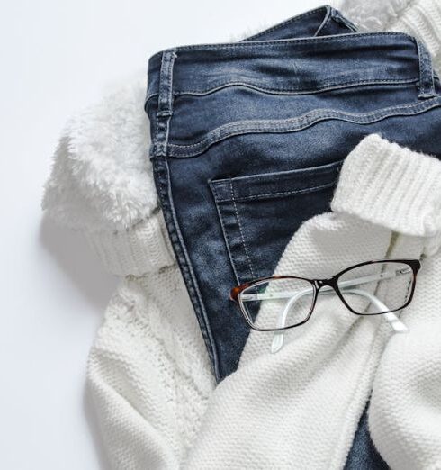 Jeans - Black Framed Eyeglasses On White Jacket And Blue Denim Bottoms