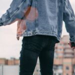 Denim - Photo of a Person Standing on Rooftop