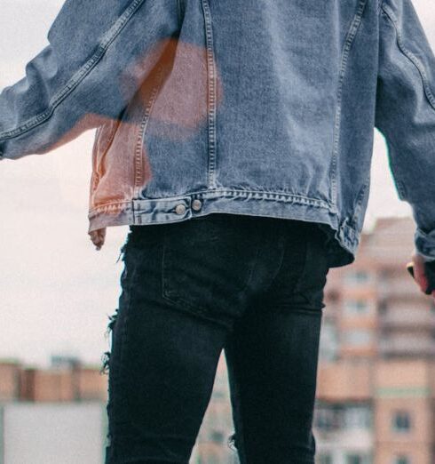 Denim - Photo of a Person Standing on Rooftop