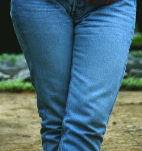 Jeans - Woman Holding Her Jeans