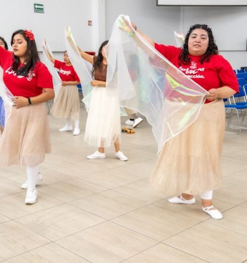 Skirts - A group of women in red and white dresses are dancing