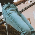 Jeans - Woman Leaning on Railing