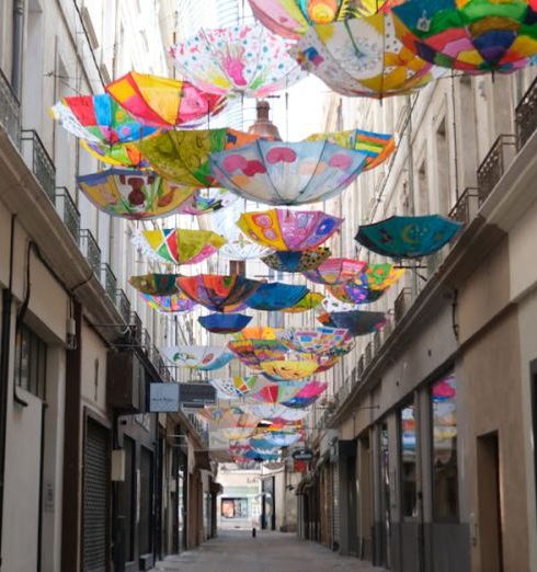 Fashion Stores - Passage Boyer Shopping Mall in Carpentras in France with Umbrellas Hanging from Ceiling