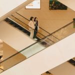 Clothing Stores - Photo of People on the Escalators