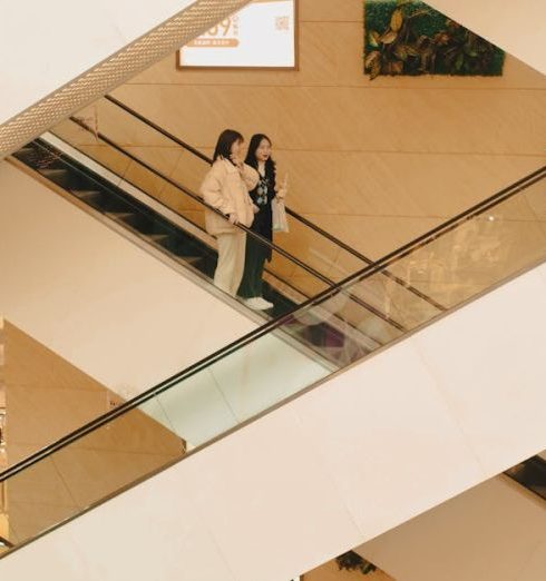 Clothing Stores - Photo of People on the Escalators