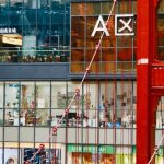 Fashion Stores - People Walking on a Red Pedestrian Footbridge in a Shopping Mall