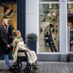 Street Style Stores - Man Pulling Woman in Wheelchair