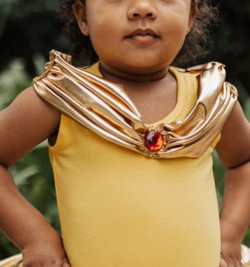 Petite Fashion - A Little Girl in a Princess Dress Standing Outside