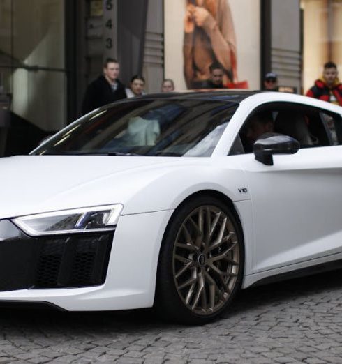 Fashion Stores - A White Luxury Car Parked on the Street