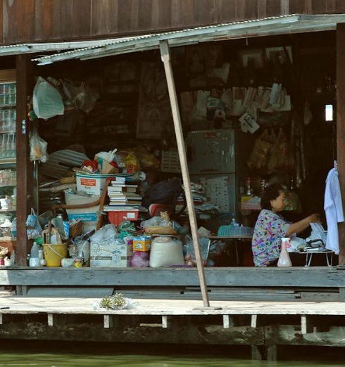 Home Goods Store - Woman Sitting and Working in Store by Water