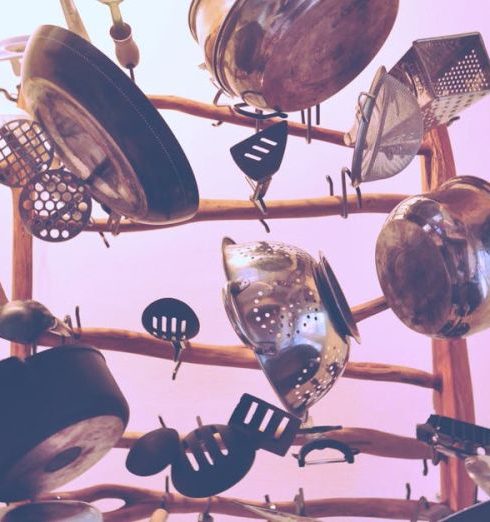 Cookware - Kitchen Cookware Piled Up on Brown Wooden Rack