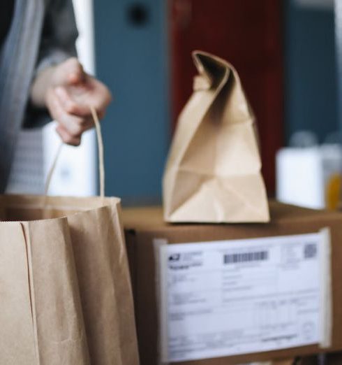 Home Goods Stores - Woman Unpacking a Shopping Bag