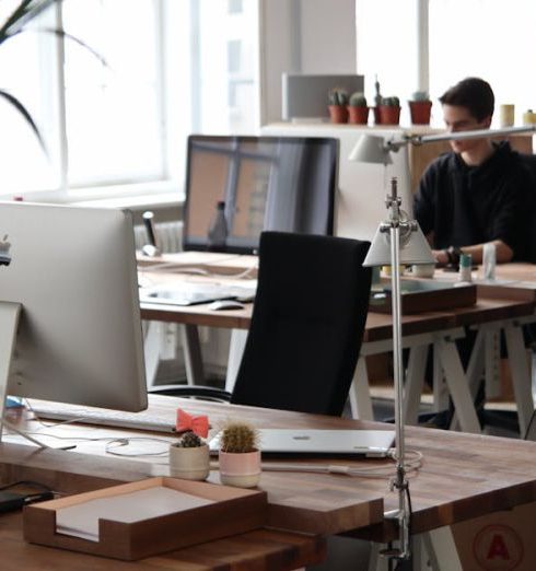 Designers - Man Sitting in Front of Computer