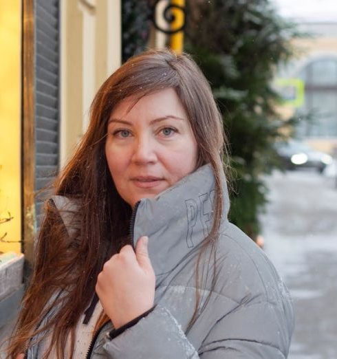 Beauty Shops - Portrait of a Long-Haired Brunette Wearing a Gray Winter Jacket