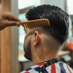 Grooming Products - Man Sitting on Barber Chair