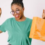 Beauty Discounts - Happy Woman Shows Her Shopping Bags