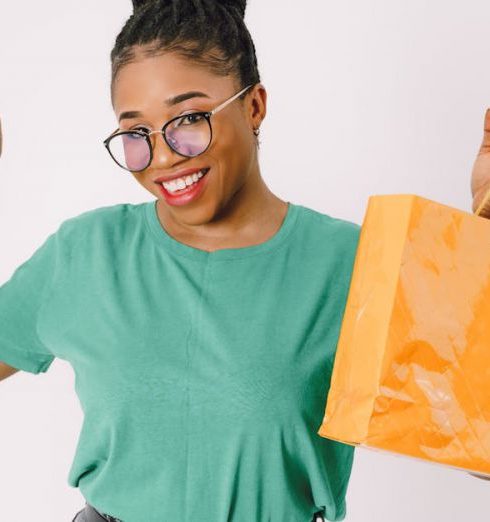 Beauty Discounts - Happy Woman Shows Her Shopping Bags