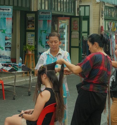 Beauty Shops - A Woman Having her Hair Done on the Street