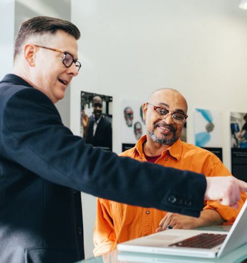 Sales - Man Pointing Laptop Computer