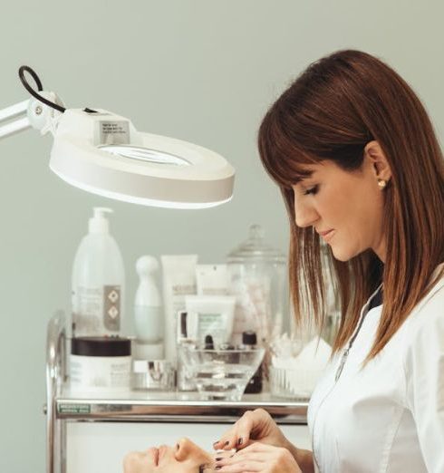 Skincare Products - Beautician Making Facial Beauty Procedures for Woman in Salon