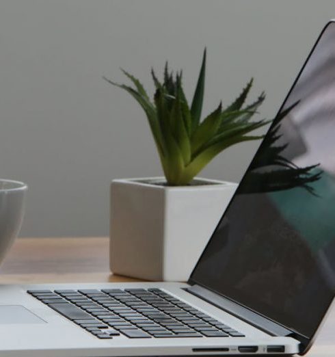 Laptops - Silver Laptop and White Cup on Table