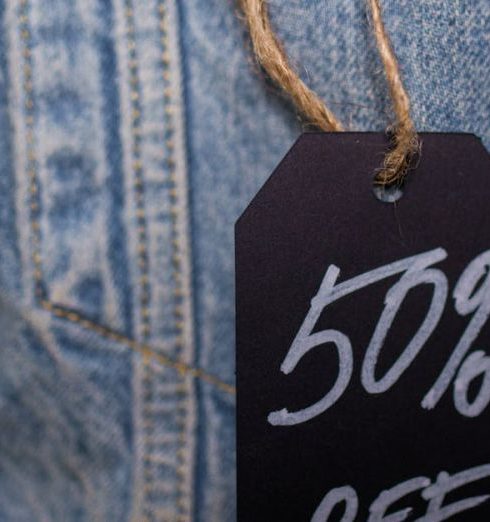 Camera Deals - A Close-Up Shot of a Tag on a Denim Clothing