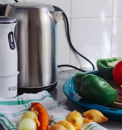 Home Appliances - Photo of Vegetables Beside Gray Electric Kettle