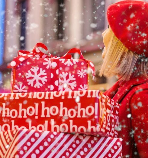 Holiday Shopping - Woman Holding Three Red Christmas Presents Boxes