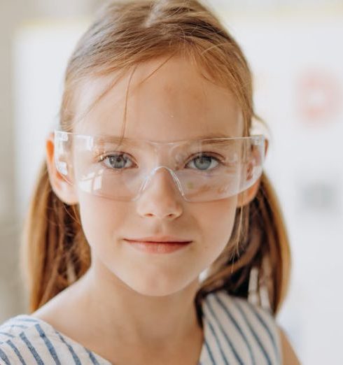 Back-to-School - Portrait of a Young Girl Wearing Safety Glasses