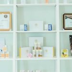 Skincare Brands - White Wooden Shelf With Assorted Bottles