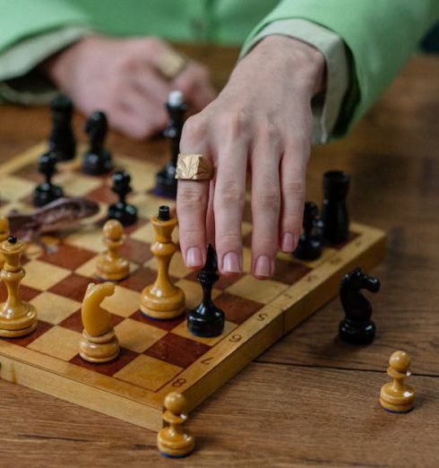 Fashion Pieces - Man in Green Suit Playing Chess