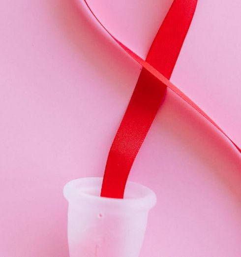 Vegan Products - Red Ribbon on a Menstrual Cup