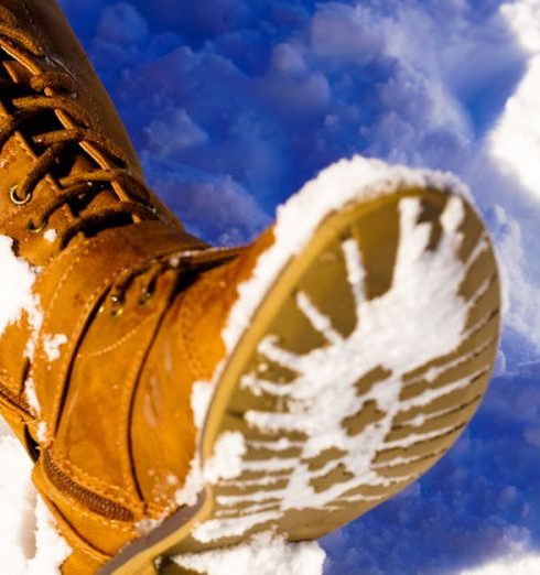 Winter Boots - Person's Left Foot on Snowfield